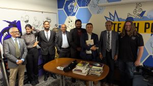 Leaders from South Central Asia stand in a row in the Tech Policy Lab office.