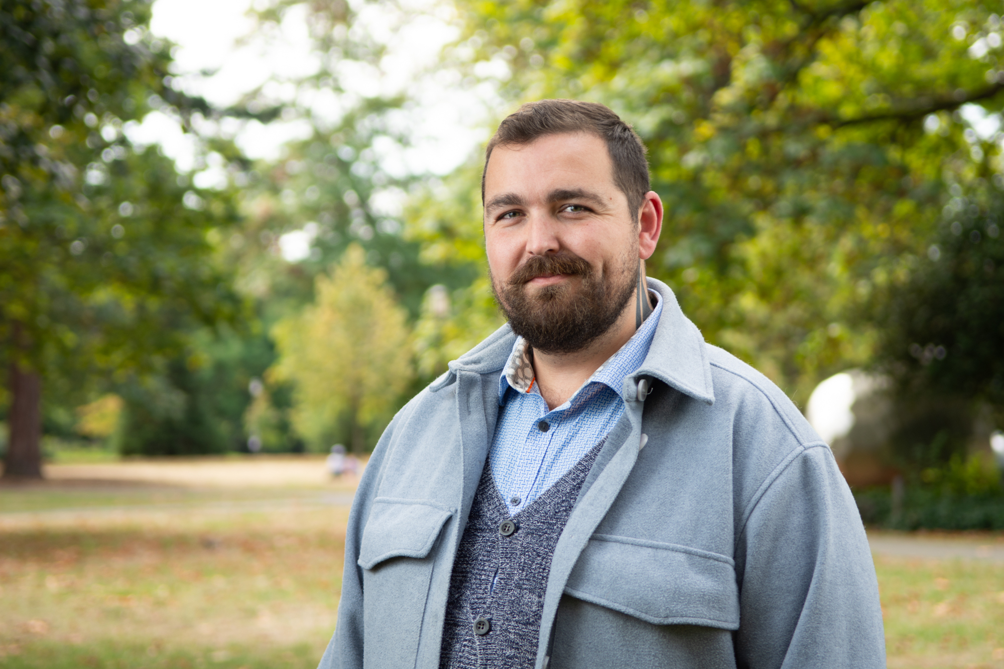Jevan Hutson on Paddington Lawn with trees in the background.